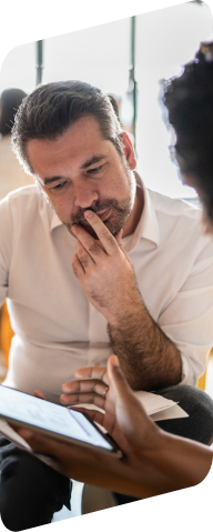 man looking at a tablet